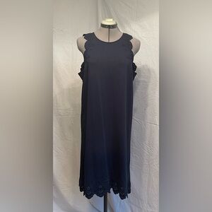 NWT.  Navy blue A-line shirt with eyelet embroidered edges.